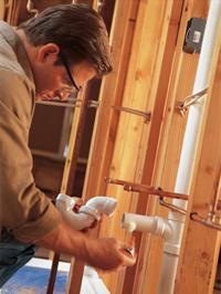 Tim is working on a garbage disposal repair in El Mirage